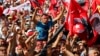 Anti-government protesters shout slogans during a demonstration in Istanbul, Turkey, June 23, 2013. 