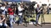 (File) Journalists report from outside the former South African President Nelson Mandela's house, in Johannesburg, South Africa Monday, Sept. 2, 2013.