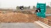 Islamic State flags flutter on the Mullah Abdullah bridge in southern Kirkuk, Iraq, Sept. 29, 2014.