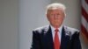 President Donald Trump stands next to the podium after speaking about the U.S. role in the Paris climate change accord in the Rose Garden of the White House in Washington, June 1, 2017. 