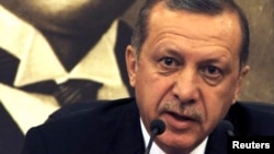 Turkey's Prime Minister Recep Tayyip Erdogan, speaks during a news conference at Ataturk International airport in Istanbul, April 4, 2014