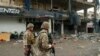 Lebanese army soldiers secure the area outside a building that was targeted in an Israeli airstrike in Beirut's southern suburbs on November 2, 2024, amid the ongoing war between Israel and Hezbollah. Lebanon's health ministry said 11 people were wounded on November 2 in an Israeli strike on Hezbollah's south Beirut stronghold, which has been hard hit by the Israel-Hezbollah war. 