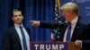 FILE - Then U.S. Republican presidential candidate Donald Trump welcomes his son Donald Trump Jr. to the stage at a campaign event in Manchester, New Hampshire November 11, 2015. 