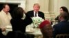 President Donald Trump joins an iftar dinner, which breaks a daylong fast, celebrating Islam's holy month of Ramadan, in the State Dining Room of the White House in Washington, Monday, May 13, 2019.