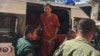 Ny Sokha, Adhoc's rights defender, was was escorted by the security officers at the appeal court, Phnom Penh, on November 28, 2016. (Kann Vicheika/VOA Khmer)