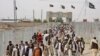 Pakistanis rally at the closed Chaman border crossing between Pakistan and Afghanistan. Islamabad is blaming Thursdays deadly terror attack in a remote town in Sindh province on a terror group it says operates out of Afghanistan.