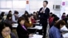 A social worker briefs a class of foreign brides from China living in Taiwan about local laws, education and their rights on the island, in Taipei, Taiwan. The government has sought to help new immigrants by offering them language classes, job training and consultative services or setting up hot lines to handle their grievances. So far, about 250,000 women called "foreign brides" in Taiwan, have come to the island. (AP Photo/Jerome Favre)