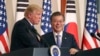 President Donald Trump, left, speaks as South Korean President Moon Jae-in looks on during a joint news conference at the Blue House in Seoul, South Korea, Tuesday, Nov. 7, 2017.