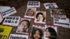 Portraits of Li Tingting (top L), Wei Tingting (top R), (bottom, L-R) Wang Man, Wu Rongrong and Zheng Churan are pictured during a protest calling for their release in Hong Kong, April 11, 2015.