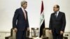 U.S. Secretary of State John Kerry, left, meets with Iraqi Prime Minister Nouri al-Maliki, right, at the Prime Minister's office in Baghdad on Monday, June 23, 2014