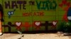 FILE - An AIDS mural is seen outside a clinic at Kumba Iron Ore, the world's largest iron ore mines in Khathu, Northern Cape Province, South Africa, Nov. 15, 2011.