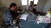 A member of the Free Revolutionary Police carries out an inspection on a measles vaccine in the southern Idlib, Sept. 17, 2014.