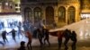 Police use a water cannon to try to disperse people protesting against newly proposed restrictions on the use of the internet and against the Turkish government during a protest on the Istiklal Avenue in Istanbul, Jan. 18, 2014. 