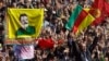 FILE - Thousands of supporters demonstrate waving various PKK flags and images of Kurdish rebel leader Abdullah Ocalan, Diyarbakir, Turkey, March 21, 2013.