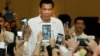 Philippine President Rodrigo Duterte, arrives a meeting with the Filipino community, in Phnom Penh, Cambodia, Tuesday, Dec. 13, 2016. Duterte on Tuesday arrived Phnom Penh on his two-day official to Cambodia. (AP Photo/Heng Sinith)