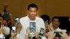 FILE - Philippine President Rodrigo Duterte, arrives at a meeting with the Filipino community, in Phnom Penh, Cambodia, Tuesday, Dec. 13, 2016. (AP Photo/Heng Sinith)