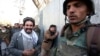 Afghans cry after an attack on a military hospital in Kabul, Afghanistan, March 8, 2017. 