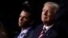 FILE - Republican Presidential Candidate Donald Trump and his son Donald Trump Jr.attend the Republican National Convention in Cleveland, July 20, 2016.