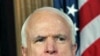 Senator John McCain listens during a news conference to discuss a Congressional resolution condemning the government of Syria for crimes against humanity and supporting the right of the people of Syria to be safe and to defend themselves, on Capitol Hill 