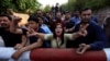 Supporters of Pakistani opposition leader Imran Khan chant anti-government slogans outside Khan's residence in Islamabad, Pakistan, October 28, 2016.