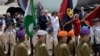 US President Donald Trump, background centre left and first lady Melania Trump participate in an arrival ceremony at Ben Gurion International Airport, May 22, 2017.