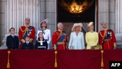 Britain's Prince George, Prince William, Prince Louis, Princess Charlotte, Princess Catherine, King Charles III, Queen Camilla, Dutchess Sophie and Prince Edward watch a flyby of military aircraft over Buckingham Palace in London on June 15, 2024.