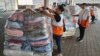 Phân phối hàng viện trợ cho người Palestine tại một nhà kho của UNRWA.