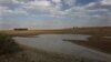 FILE - Taps and water sources are dry in South Africa's almost depleted local dam in Senekal, Jan. 7, 2016. Senekal, a small town in South Africa’s rural Free State province, is one of four regions declared disaster areas as drought dries up the country's heartland.