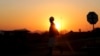 FILE - A miner returns from his shift in Nkaneng township outside the Lonmin mine in Rustenburg, northwest of Johannesburg, June 26, 2015. 