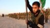 Members of the Shiite Muslim Mehdi Army militia train in the southern Iraqi city of Basra, June 17, 2014.