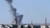 Smoke rises after an airstrike in Kobani, Syria as fighting intensified between Syrian Kurds and Islamic State fighters, as seen from the outskirts of Suruc, at the Turkey-Syria border, Oct. 7, 2014.