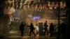 Demonstrators clash with riot police following the funeral of Berkin Elvan, who had been in a coma after a police tear-gas canister struck him in the head last year, in Istanbul, March 12, 2014. 