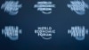 FILE - A logo, taken with long exposure, is shown at the World Economic Forum headquarters in Cologny near Geneva.