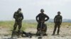 FILE - Afghanistan's National Army soldiers take positions in Khogyani district, in Nangarhar province, east of Kabul, Afghanistan. 