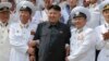 FILE- North Korean leader Kim Jong Un (C) poses with officers and sailors of Korean People's Army in this undated photo released by North Korea's Korean Central News Agency (KCNA) in Pyongyang June 16, 2014.