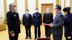 In this photo released by Russian Embassy in the DPRK/Russian Foreign Ministry Press Service on Tuesday, May 5, 2020, Russian Ambassador to Democratic People's Republic of Korea Alexander Matsegora, left, and Democratic People's Republic of Korea…