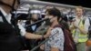 Policemen in riot gears arrest a protester during a demonstration at the Airport in Hong Kong, Aug. 13, 2019. 