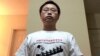 University of Georgia graduate student, Gu Yi poses for a self-portrait wearing a T-shirt with the words “Support Tiananmen Mothers” at his home in Athens, Georgia. Gu is author of an open letter calling for his compatriots to learn more about the Tiananm