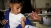 FILE - A boy receives a diphtheria vaccine at a hospital in Sanaa, Yemen, Sept. 9, 2019.