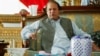 Nawaz Sharif, the leader of Pakistan Muslim League - Nawaz (PML-N), points as he speaks to foreign reporters at his residence in Lahore May 13, 2013. Sharif, who is poised for victory after Pakistan's May 11 election, said he had spoken at length with Pri