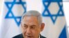 Israeli Prime Minister Benjamin Netanyahu chairs during the weekly Cabinet meeting being held in the Jordan Valley, in the Israeli-occupied West Bank, Sept. 15, 2019.