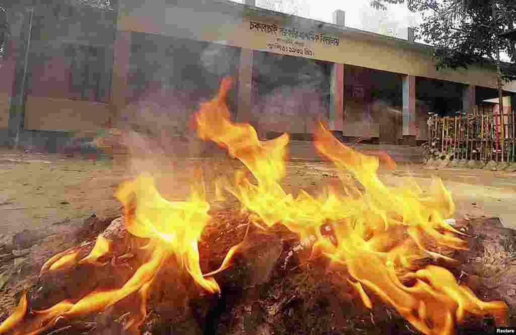 Election materials are set ablaze in front of a polling booth after an attack by protesters in Bogra, Bangladesh, Jan. 5, 2014.