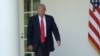 FILE - President Donald Trump walks out of the Oval Office into the Rose Garden of the White House in Washington, June 1, 2017. 