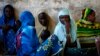 Internally displaced women from Bangui attend a community meeting in Bambari, Central African Republic, June 16, 2014.