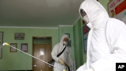 Offices at the Phyongchon District People's Hospital are disinfected to help curb the spread of the coronavirus on Wednesday, April 1, 2020, in Pyongyang, North Korea.