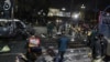 Police and security officers cordon off the area of a deadly bombing, in Lahore, Pakistan, Feb. 13, 2017.