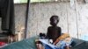 FILE - A South Sudanese child suffering from cholera sits on a bed in Juba Teaching Hospital.