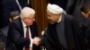 FILE - Iraq's President Fuad Masum, left, is greeted by Iranian President Hassan Rouhani as he arrives at the Climate Summit 2014 at U.N. headquarters, Sept. 23, 2014. 