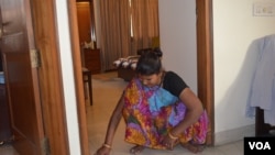 Maid Komal Devi wants to open a bank account for her savings, VOA/Anjana Pasricha.