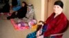 A Christian family, who fled from the violence in Mosul two days ago, stays at a school in Arbil, in Iraq's Kurdistan region, June 27, 2014.